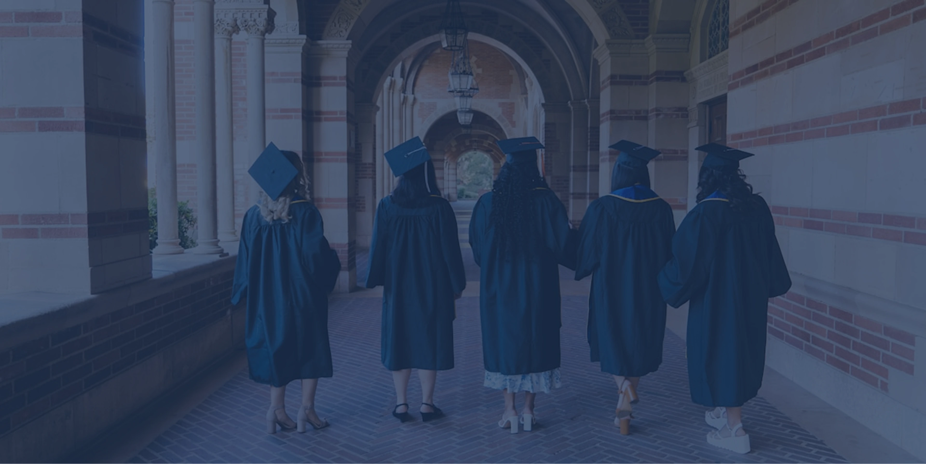 Graduates walking through a university corridor