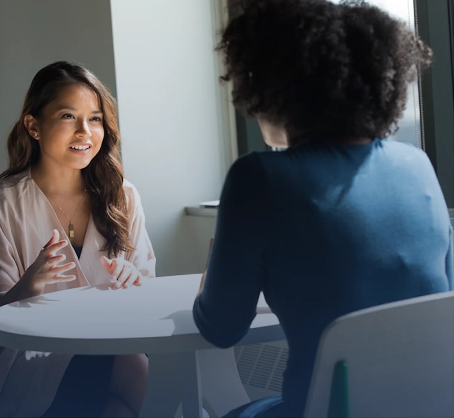 Two educators in a counseling meeting