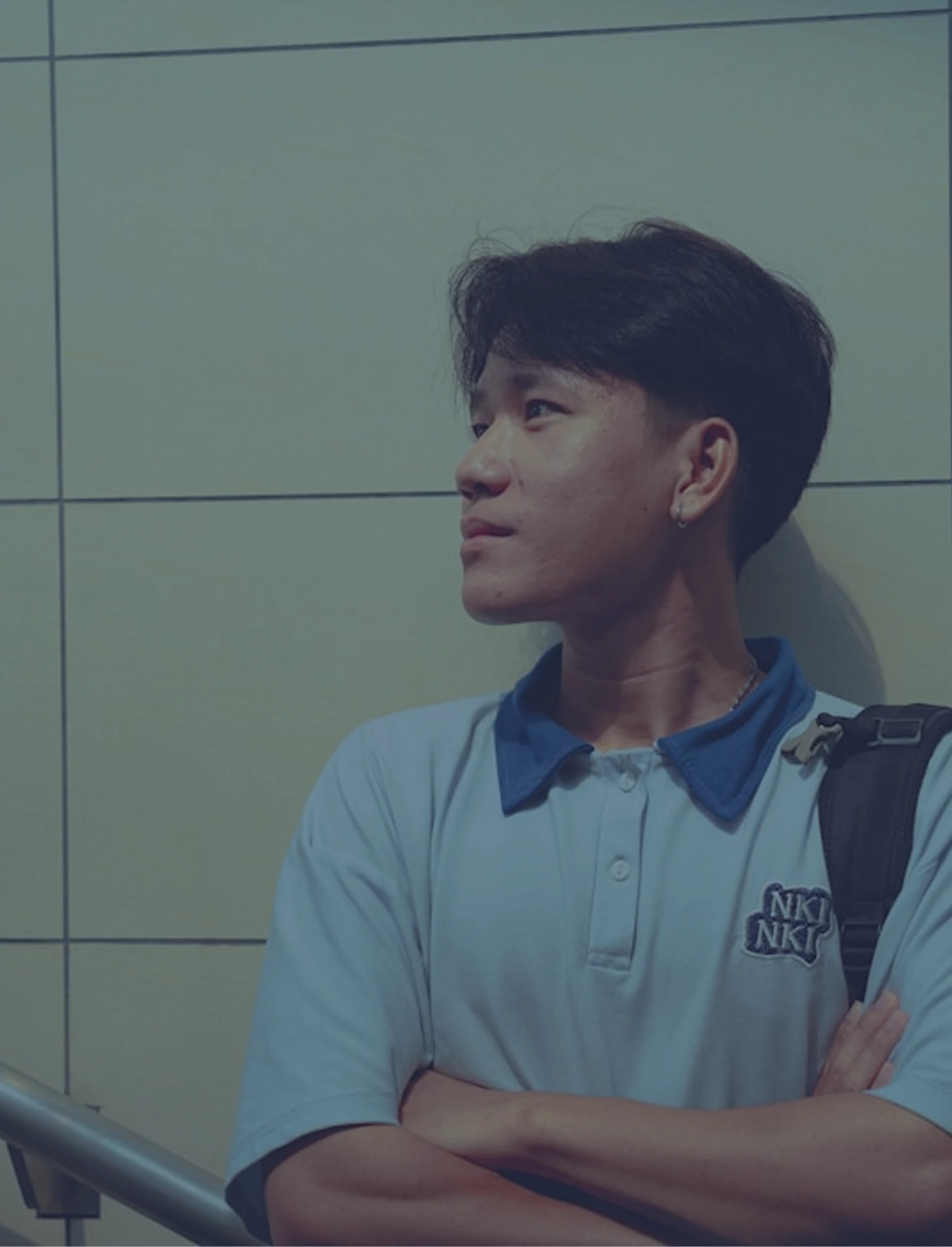 Student looking thoughtfully to the side