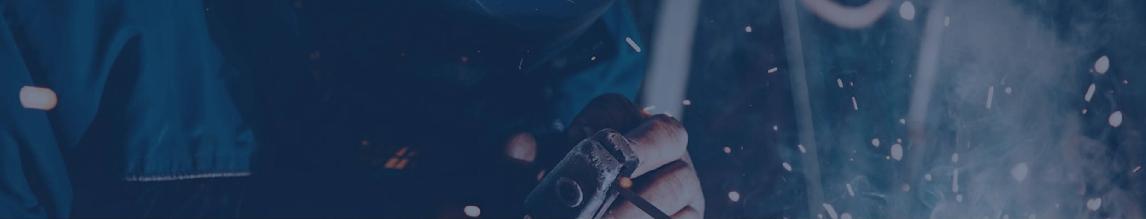 Welder at work with sparks flying